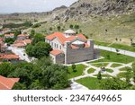 Sivrihisar, Eskisehir, Turkey - June 16 2023: Aerial view of Sivrihisar city with Surp Yerrortutyun Armenian Church at sunset.