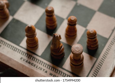 Six Chess Pieces On A Chessboard