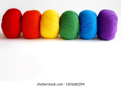 Six Different Balls Of Yarn In Rainbow Colors - Empty Space For Text, Information Or Promotion