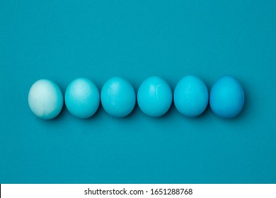 Six easter eggs in blue gradient color design blue background