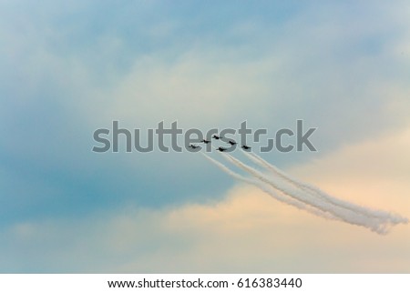 Six Fighter Jets doing a Fly By with jet trails