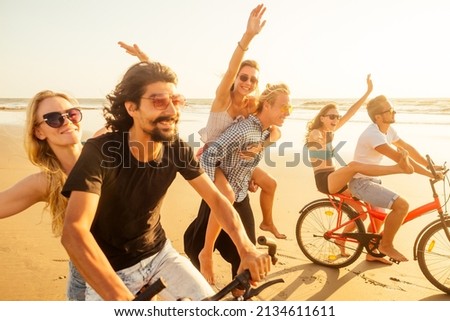 six friends meeting on the beach in Goa India and having time together