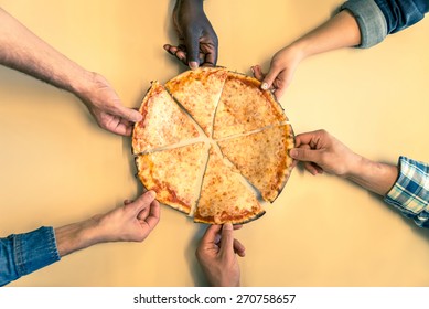 Six Friends Sharing A Pizza In A Restaurant - Hands Taking A Pizza Margherita Slice - Concepts About Food,nutrition,party And Friendship