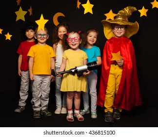 Six Kids In Stargazers Costumes With Telescope