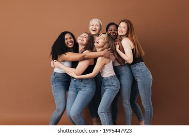 Six laughing women of a different race, age, and figure type. Group of multiracial females having fun against a brown background. - Shutterstock ID 1995447923