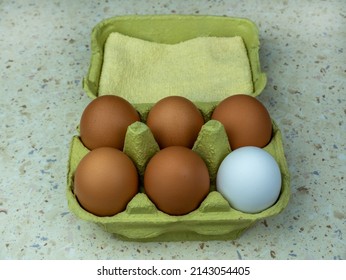 Six Natural Eggs In A Green Cardboard Box. View From Above. Copy Space.