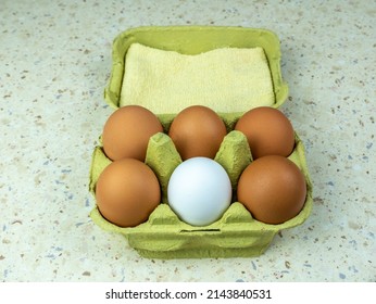 Six Natural Eggs In A Green Cardboard Box. View From Above. Copy Space.