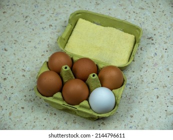 Six Natural Eggs In A Green Cardboard Box. View From Above.