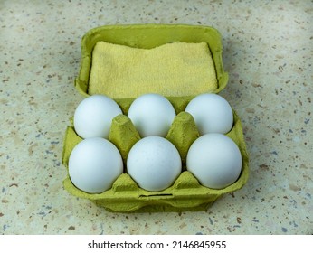 Six Natural Eggs In A Green Cardboard Box. View From Above. Copy Space.