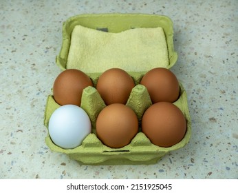 Six Natural Eggs In A Green Cardboard Box. View From Above. Copy Space.