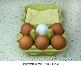 Six Natural Eggs In A Green Cardboard Box. View From Above. Copy Space.