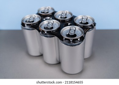 Six Pack Of Aluminum Cans With Paper Holder