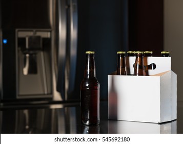 Six Pack Of Brown Beer Bottles On Kitchen Counter