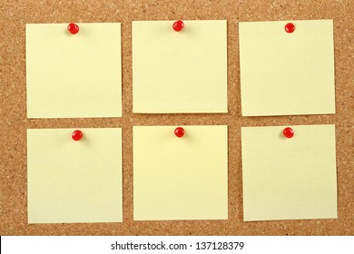 Six Post It Notes On Corkboard