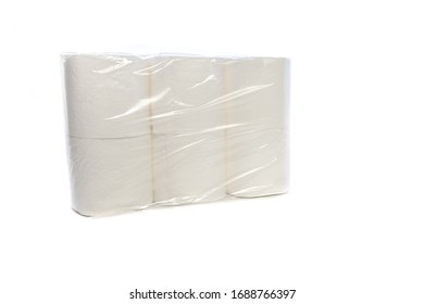 Six Rolls Of Toilet Paper In A Pack Sealed With Plastic Against A White Background