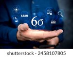 Six Sigma, Lean manufacturing, quality control and industrial process improving concept. Businessman touching lean six sigma button for improved manufacturing