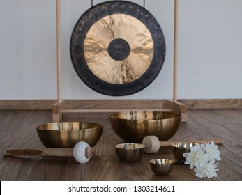 six singing bowls with gong in the background 