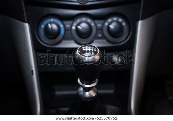 Six speed\
gear shift in car . Gear\
transmission.