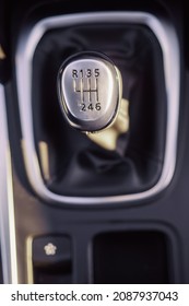 Six Speed Manual Gear Box Top Down View, Selective Focus. Framed By Metallic Decorative Frame.