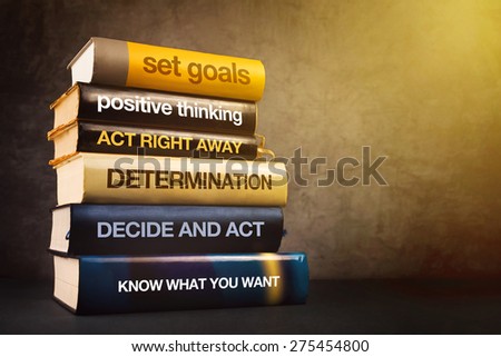 Six Steps to Business Success Literature, Mastering Business Management Concept with Stack of Published Books.