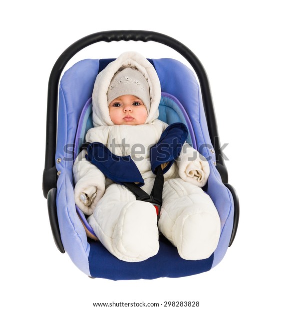 Six-month baby in a\
Car Seat, isolated on\
white