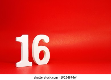 Sixteen ( 16 ) white number wooden on Red Background with Copy Space - New promotion 16% Percentage  Business finance Concept 