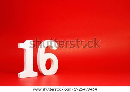 Sixteen ( 16 ) white number wooden on Red Background with Copy Space - New promotion 16% Percentage  Business finance Concept 