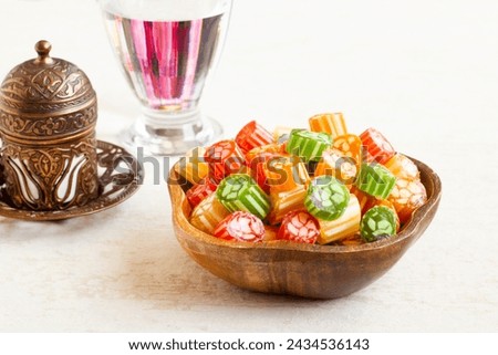 A sixteenth-century flavor Traditional Turkish Hard Colorful Candy is Akide in bamboo bowl with Turkish Coffee
