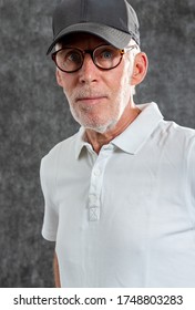 A Sixty Year Old Man Wearing A Baseball Cap