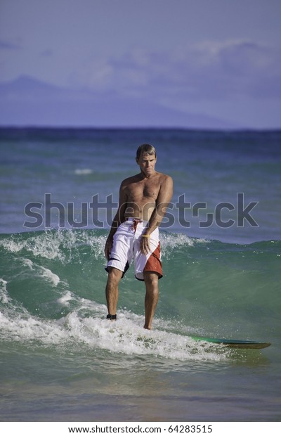 Sixtyfour Year Old Man Surfing Hawaii Stock Photo (Edit Now) 64283515