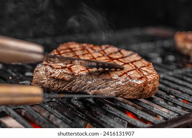 sizzling steak cooking on the grill 