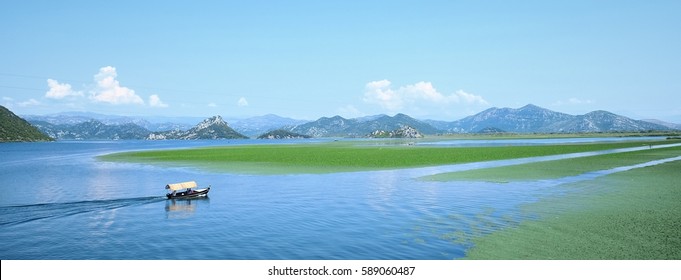 Skadar Lake wide view and tourist boat, Montenegro