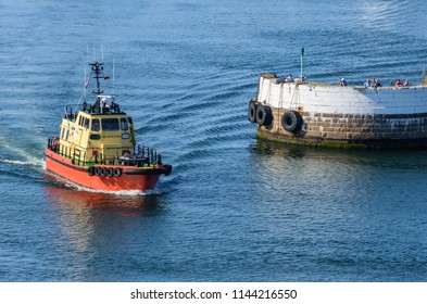 Skagen, Denmark - June 03 2018: A Small Boat Sails Out Of Skagen Harbour On A Sunny Summer Evening