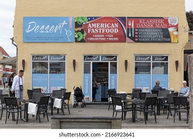 Skagen, Denmark June 7, 2022 The Facade Of An American Fast Food Restaurant And Guests And Table.