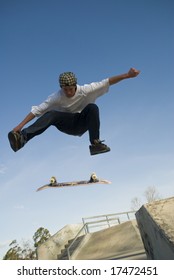 Skate Boarder Jumping With Board Flipping