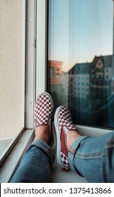 Skate guy sitting at the window drinking coffee skating on the street with fashion and lifestyle matthias dengler snapshopped wearing sneakers shoes in urban style and fashion lifestyle nürnberg