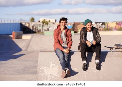 Skate park, portrait and skater friends relax outdoor after fun session, training or bonding on vacation. Skateboard, hobby and gen z male people chilling on a ramp for break, holiday or boarding - Powered by Shutterstock