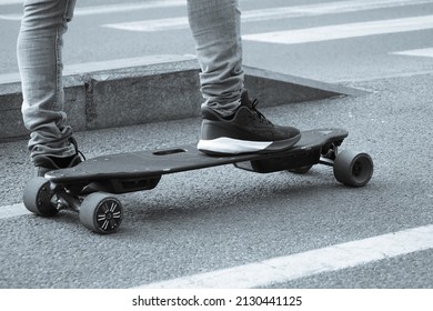 Skateboard. Skateboard Foot Detail. Young Man Waiting At The Traffic Light To Cross On His Skateboard.