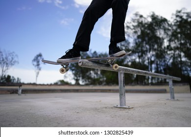 Skateboard grind feeble smith boardslide 360 - Shutterstock ID 1302825439