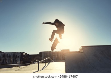 Skateboard, man and jumping in urban skate park with trick and training in Los Angeles with speed. Sunshine, deck and skater in the city with balance, skating competition and fun board flip by ramp - Powered by Shutterstock