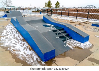 Skateboard Ramp With Melting Snow On A Sunny Day