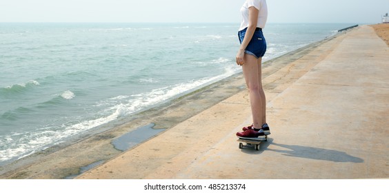 skateboard-recreational-pursuit-summer-beach-holiday-stock-photo