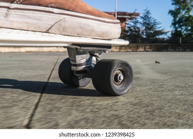 Skateboard Wheel Close Up And Shoes On White Board