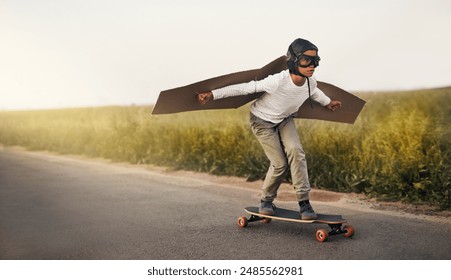 Skateboard, wings and child flying outdoor on road for airplane game, sport and holiday. Pilot, freedom and kid in helmet on street for childhood dream, fantasy and playing pretend for adventure - Powered by Shutterstock