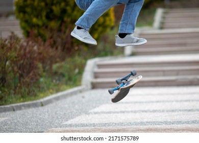 Skateboarder doing jump trick in urban location - Powered by Shutterstock