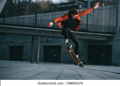 skateboarder doing jump trick in urban location - Powered by Shutterstock