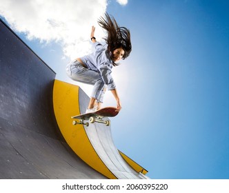 Skateboarder doing a jumping trick. Freestyle extreme sports concept