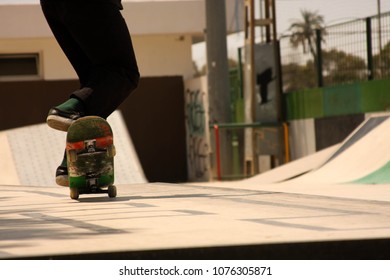 Skateboarder , doing a nose manual at a public skatepark - Powered by Shutterstock