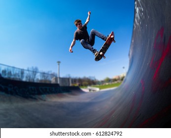 Skateboarder Doing Ollie On Ramp