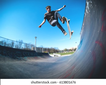 Skateboarder Doing Ollie On Ramp